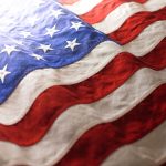 USA background of waving American flag. For 4th of July, Memorial Day, Veteran's Day, or other patriotic celebration.