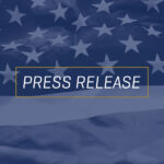 Press Release default image with the American flag in the background.