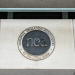 Washington, DC - June 27, 2022: Logo for the National Education Association above the entry at the DC Headquarters.