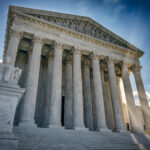 A summer day in front of the US Supreme Court Building in Washington, DC.